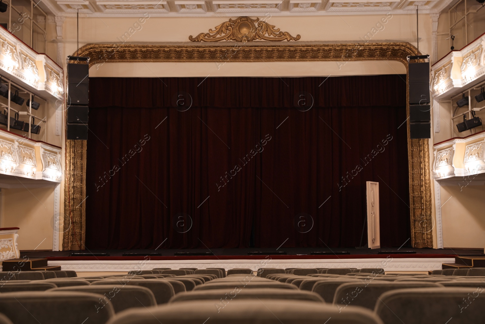 Photo of Theatre interior with stage and rows of comfortable seats