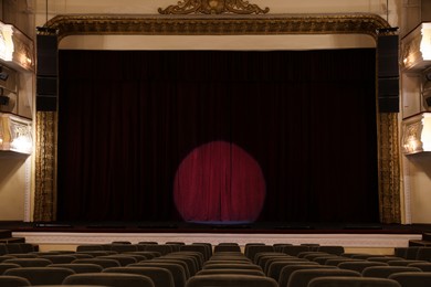 Photo of Theatre interior with stage and rows of comfortable seats