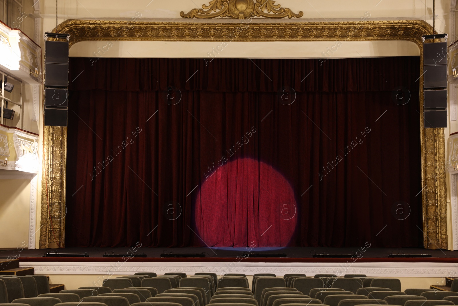 Photo of Theatre interior with stage and rows of comfortable seats