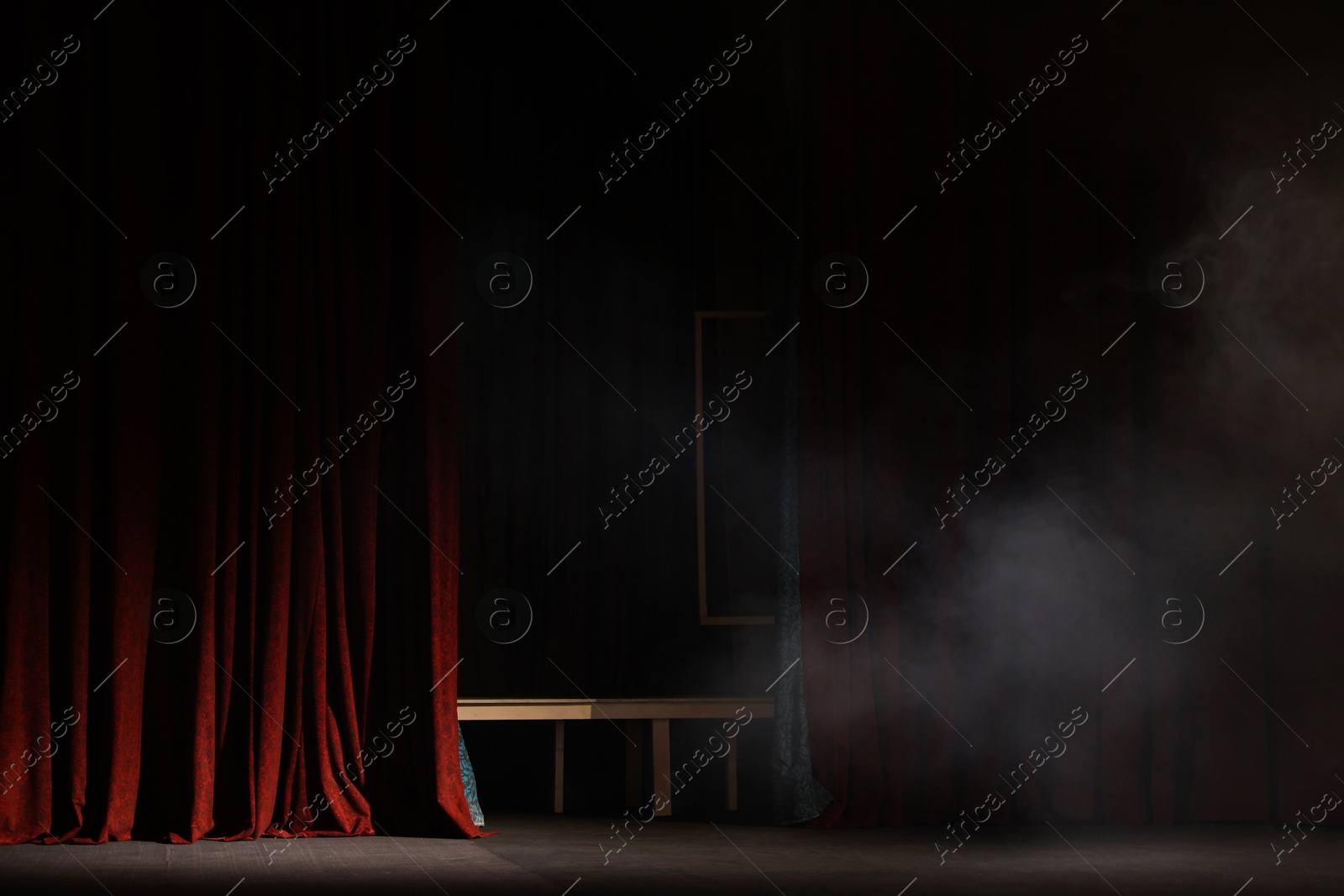 Photo of Smoke on dark stage in modern theatre