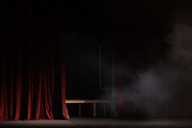 Photo of Smoke on dark stage in modern theatre