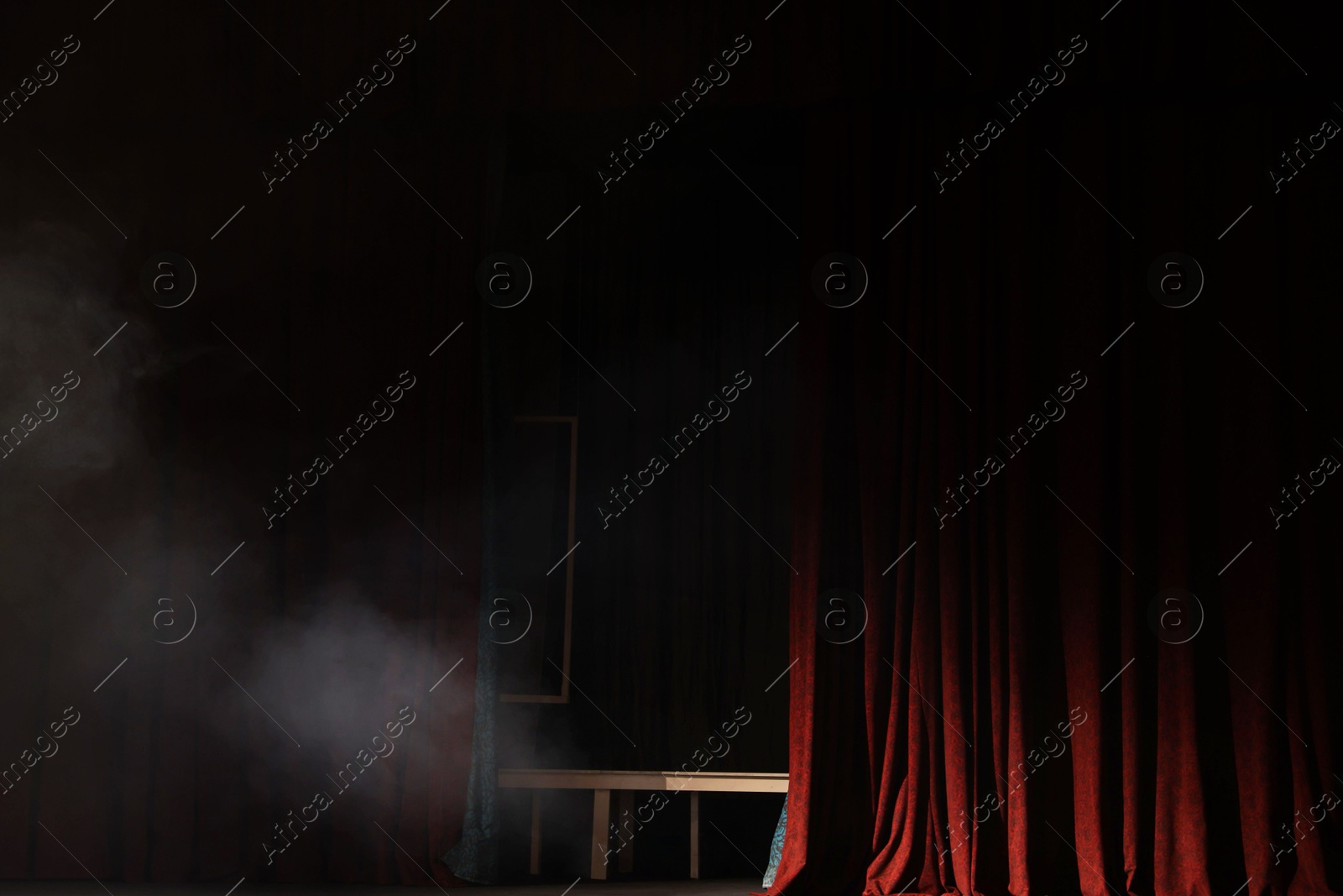 Photo of Smoke on dark stage in modern theatre