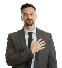 Photo of Man making promise on white background. Oath gesture