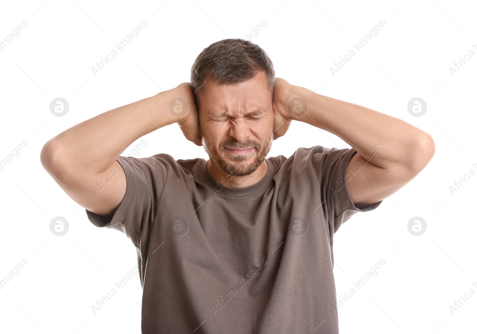 Photo of Man covering his ears on white background