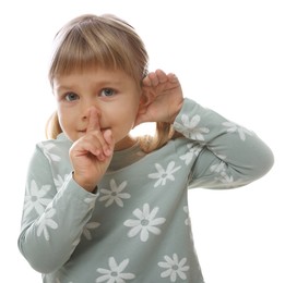 Photo of Little girl showing hand to ear gesture on white background