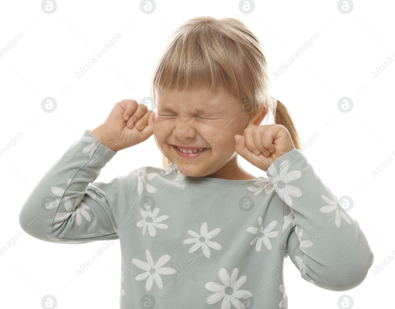 Photo of Little girl covering her ears with fingers on white background