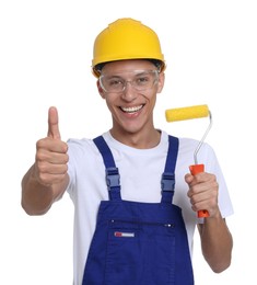 Photo of Portrait of young decorator with paint roller on white background