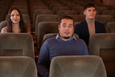 Photo of Group of people watching theatrical performance in theatre