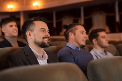 Photo of Group of people watching theatrical performance in theatre