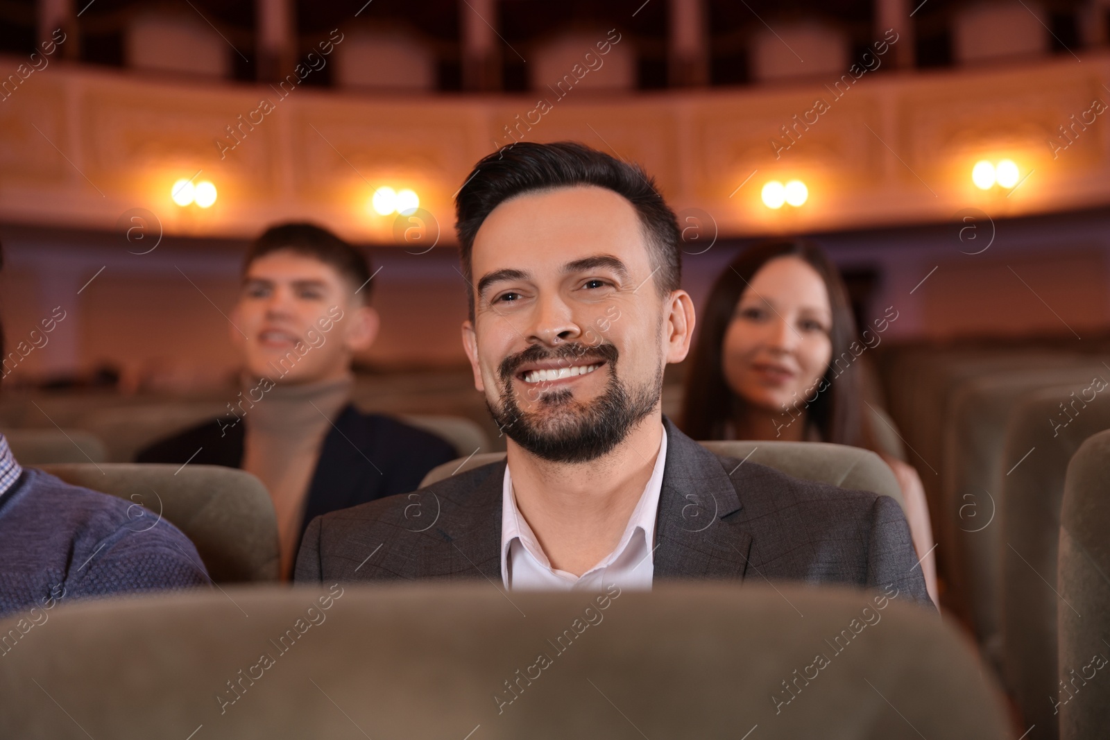 Photo of Group of people watching theatrical performance in theatre