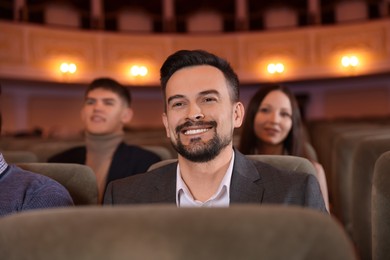 Photo of Group of people watching theatrical performance in theatre