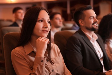 Photo of Group of people watching theatrical performance in theatre