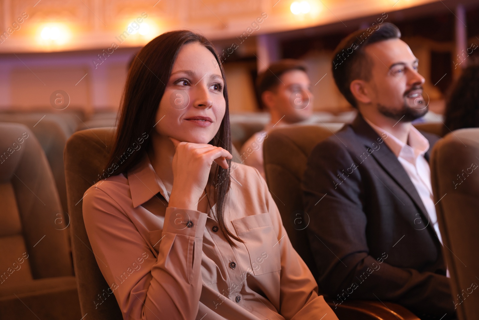 Photo of Group of people watching theatrical performance in theatre