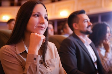 Photo of Group of people watching theatrical performance in theatre