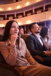 Photo of Group of people watching theatrical performance in theatre