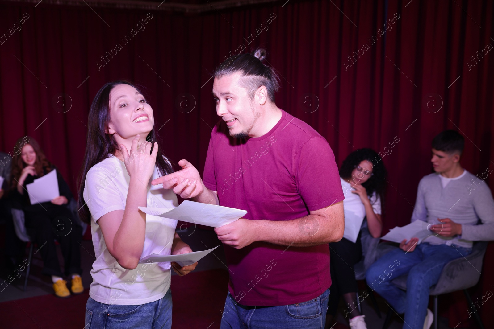 Photo of Professional actors rehearsing on stage in theatre