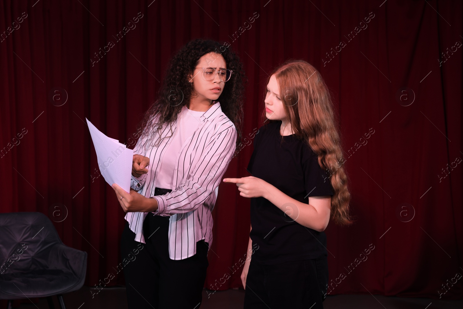 Photo of Professional actors rehearsing on stage in theatre