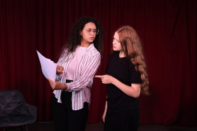 Photo of Professional actors rehearsing on stage in theatre