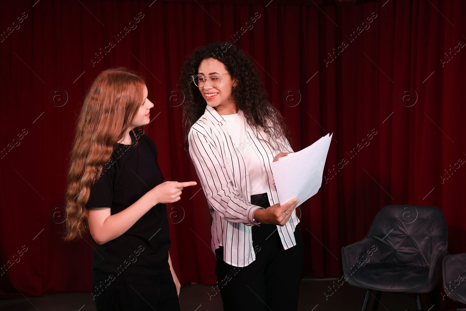 Photo of Professional actors rehearsing on stage in theatre