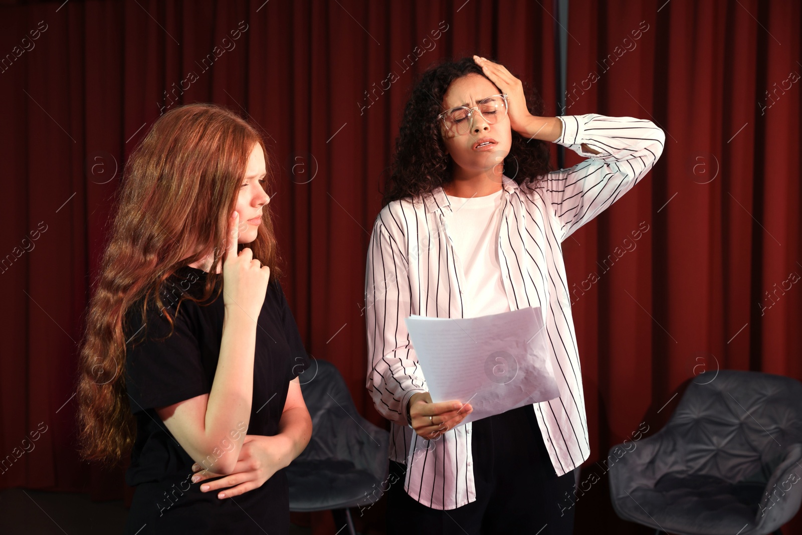 Photo of Professional actors rehearsing on stage in theatre