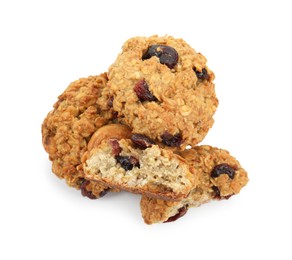 Photo of Delicious oatmeal cookies with dried cranberries and nuts isolated on white, top view