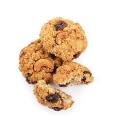 Photo of Delicious oatmeal cookies with dried cranberries and nuts isolated on white, top view