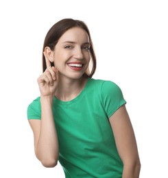 Photo of Woman showing hand to ear gesture on white background