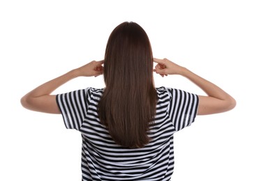 Photo of Woman covering her ears on white background, back view