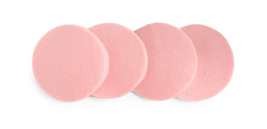 Photo of Slices of tasty boiled sausage isolated on white, top view