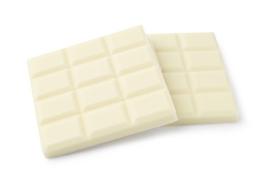 Photo of Pieces of delicious white chocolate isolated on white