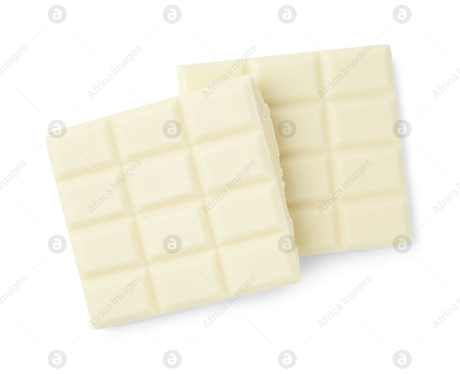 Photo of Pieces of delicious white chocolate isolated on white, top view