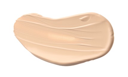 Photo of Skin foundation isolated on white, top view. Sample of cosmetic product