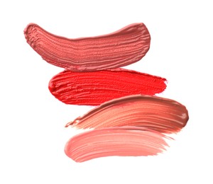 Photo of Different lipsticks isolated on white, top view. Samples of cosmetic product