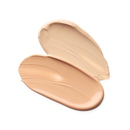 Photo of Skin foundation isolated on white, top view. Samples of cosmetic product