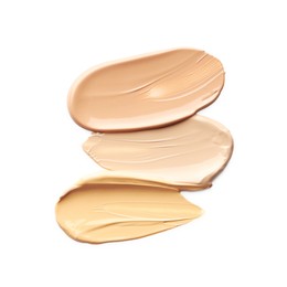 Photo of Skin foundation isolated on white, top view. Samples of cosmetic product