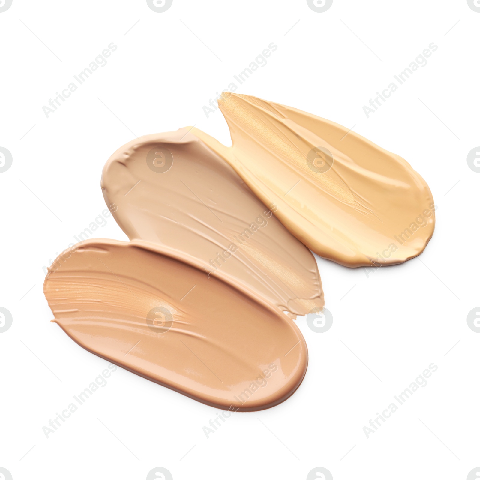 Photo of Skin foundation isolated on white, top view. Samples of cosmetic product