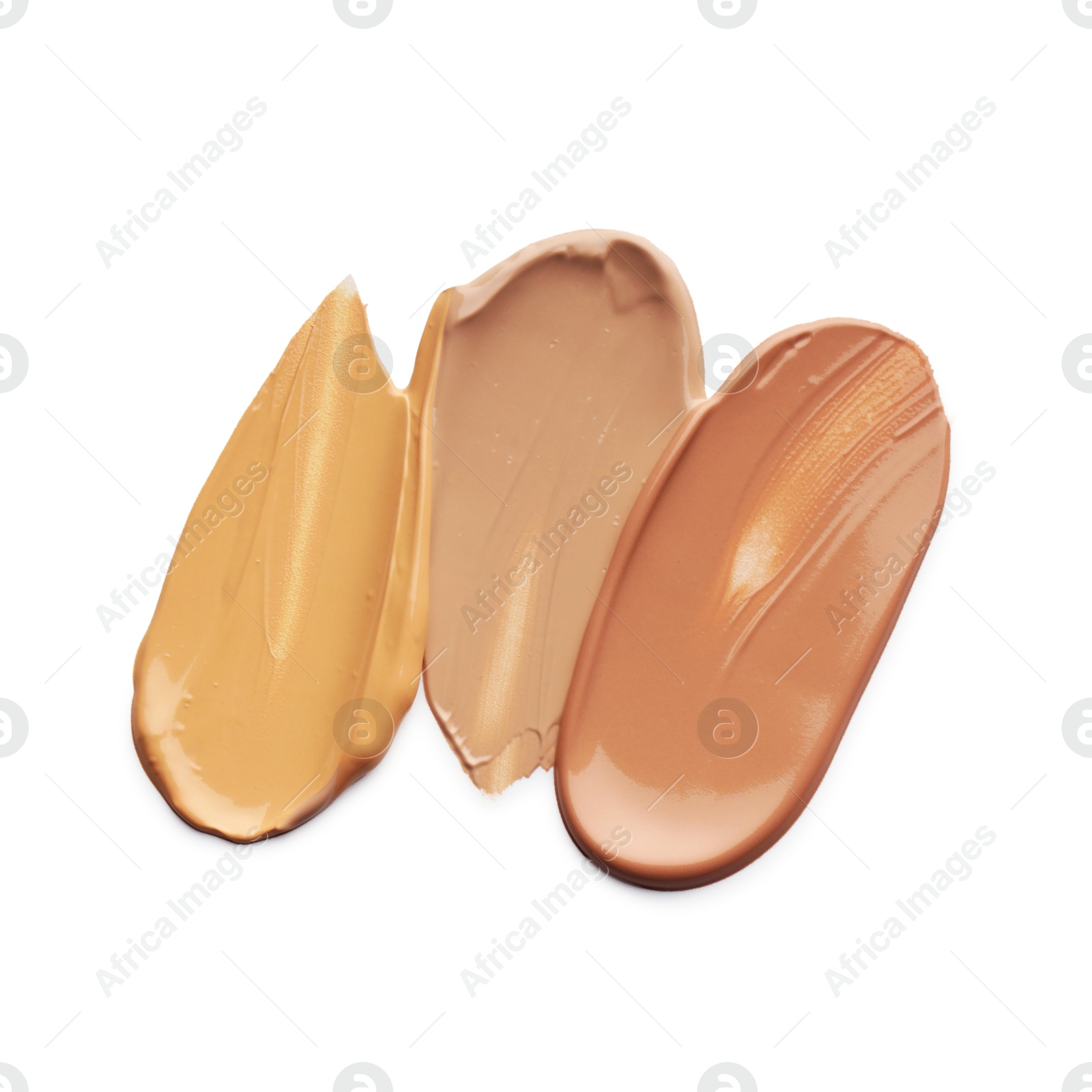 Photo of Skin foundation isolated on white, top view. Samples of cosmetic product