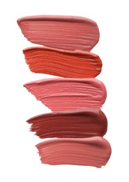 Photo of Different lipsticks isolated on white, top view. Samples of cosmetic product