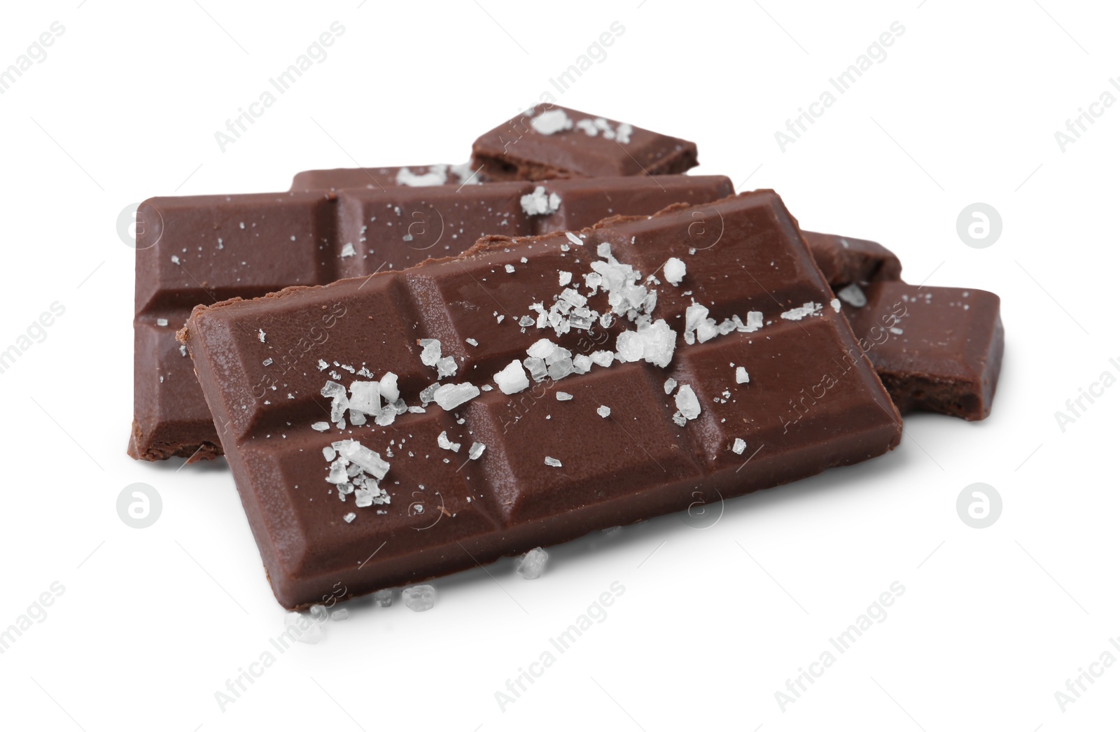 Photo of Pieces of chocolate with salt isolated on white