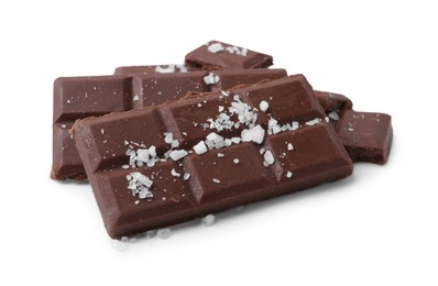 Photo of Pieces of chocolate with salt isolated on white