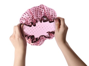 Photo of Woman holding pink shower cap on white background, closeup