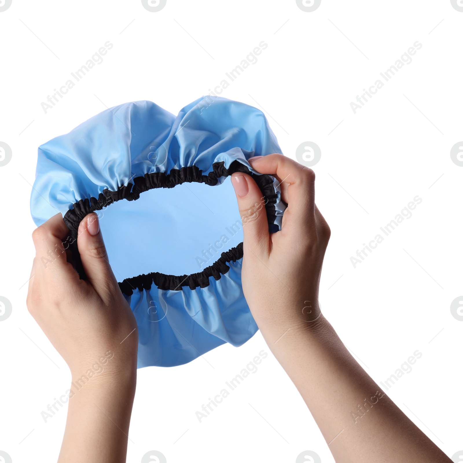 Photo of Woman holding blue shower cap on white background, closeup