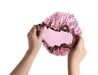 Photo of Woman holding pink shower cap on white background, closeup