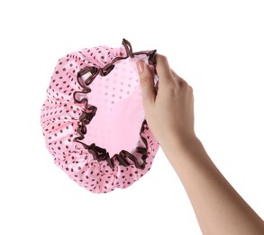 Photo of Woman holding pink shower cap on white background, closeup