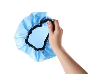 Photo of Woman holding blue shower cap on white background, closeup