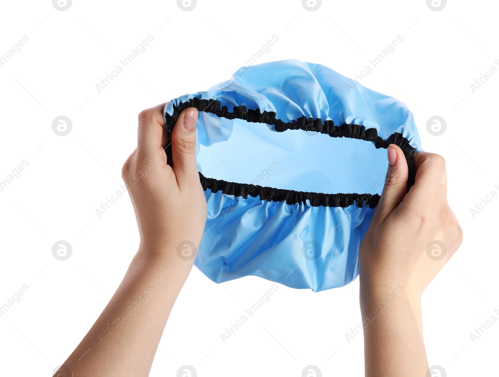 Photo of Woman holding blue shower cap on white background, closeup