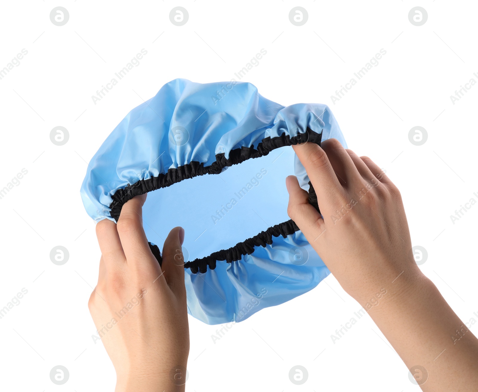 Photo of Woman holding blue shower cap on white background, closeup