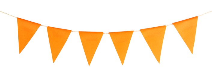 Photo of Orange party flags isolated on white. Festive decor