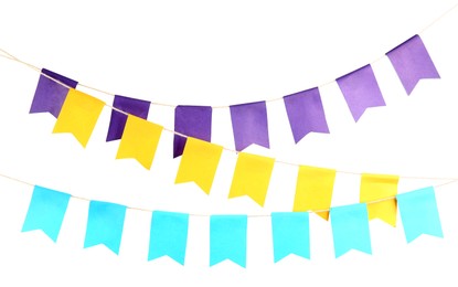 Photo of Colorful party flags isolated on white. Festive decor