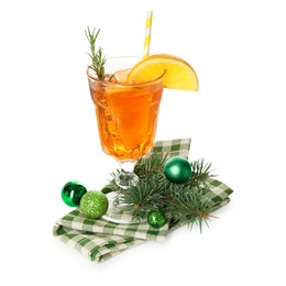 Photo of Tasty Christmas cocktail in glass, baubles and fir tree branches isolated on white